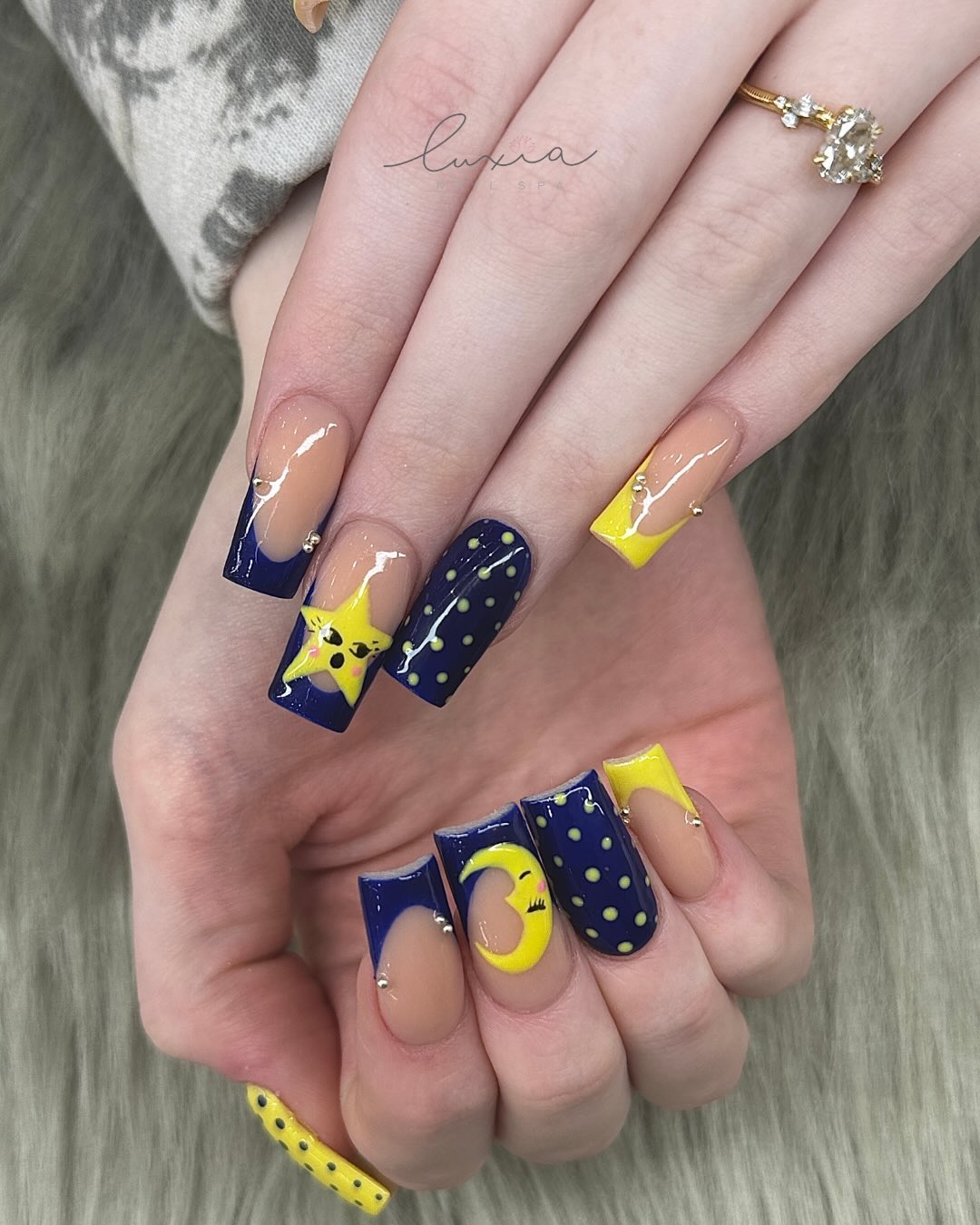 Navy and yellow starry night design with moon character
